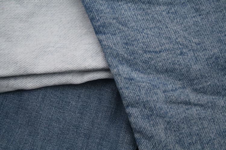 Cut microfibre release at source in denim finishing